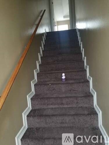 A staircase with a person standing on the top.