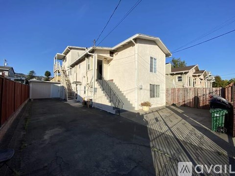 A house with a driveway in front of it.