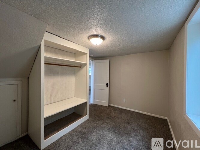 A small bedroom with a built-in bunk bed.
