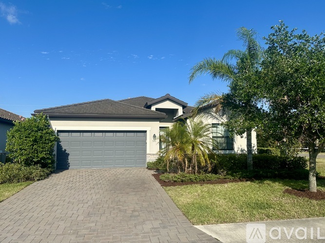 A house with a driveway and a garage door.