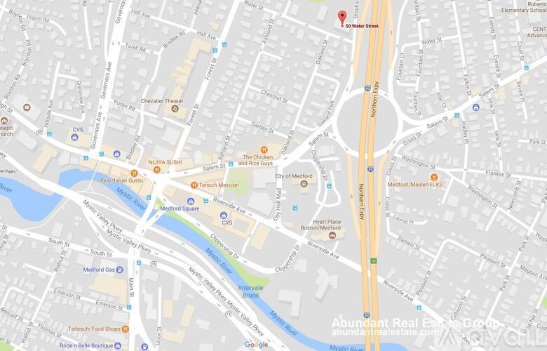 A map shows a section of a city with streets, buildings, and a body of water.
