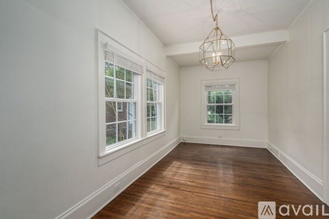 A kitchen with a stainless steel refrigerator and a ceiling fan.