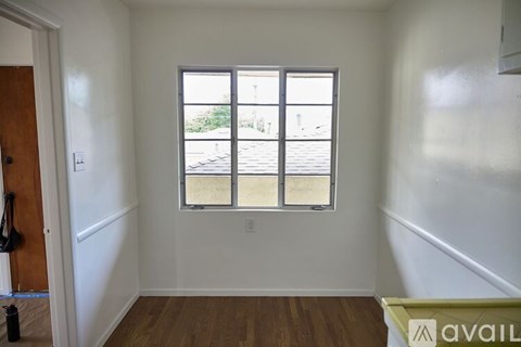 A room with a window and a door.
