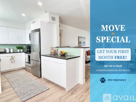 A kitchen with a sign offering a free first month of rent.