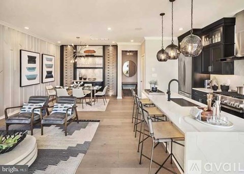 A modern kitchen with a dining area and a bar.