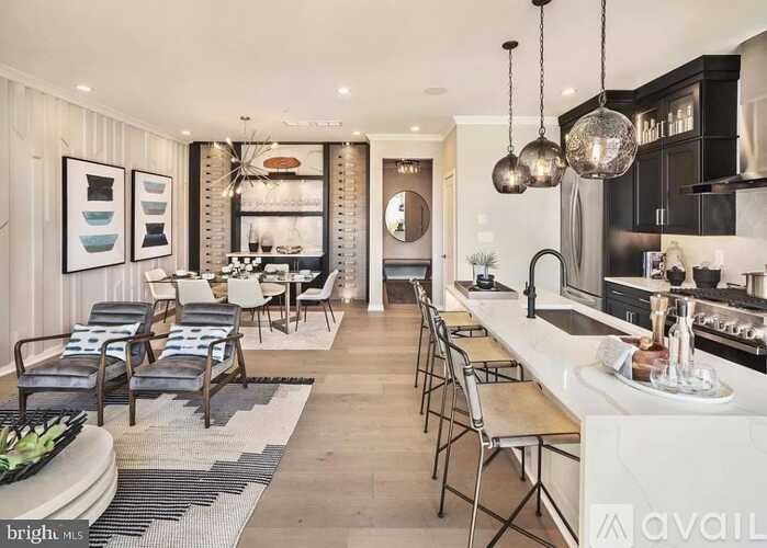 A modern kitchen with a dining area and a bar.