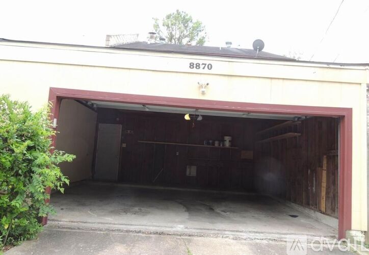 A garage with the number 8870 on the top of the building.