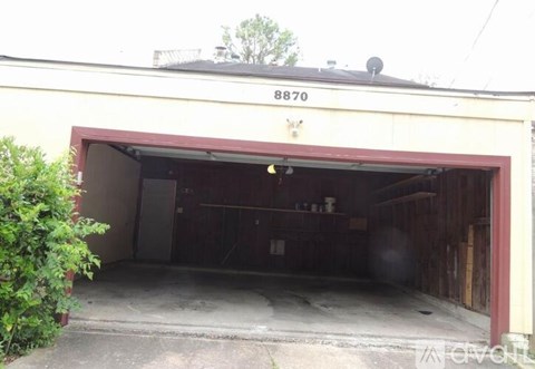 A garage with the number 8870 on the top of the building.