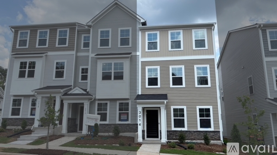 A row of houses with the first one on the left being a two story building with a balcony.