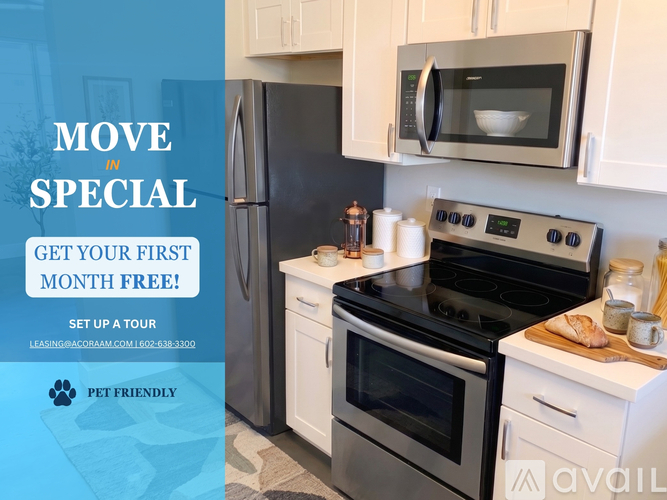 A kitchen with a refrigerator, microwave, and oven, with an offer for a free first month.