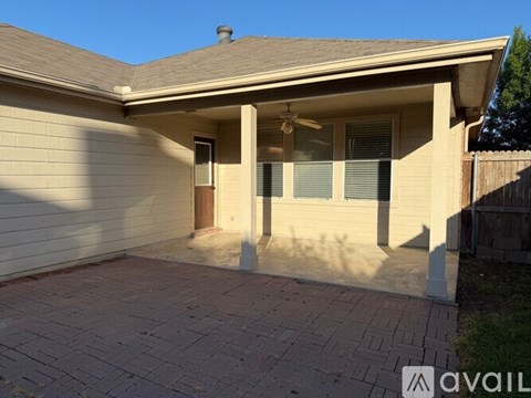 A house with a garage and a driveway.