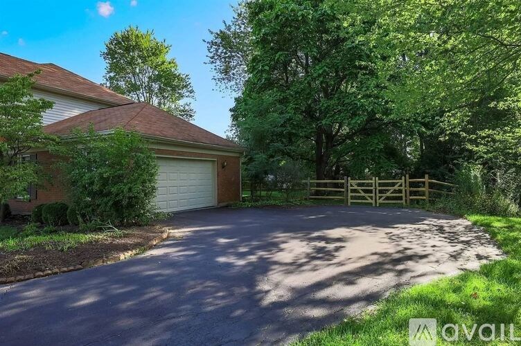 A house with a driveway and a garage door.