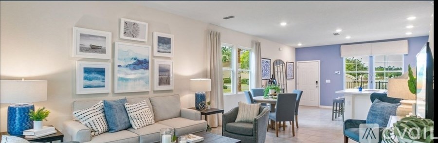 A living room with a grey couch and a coffee table.