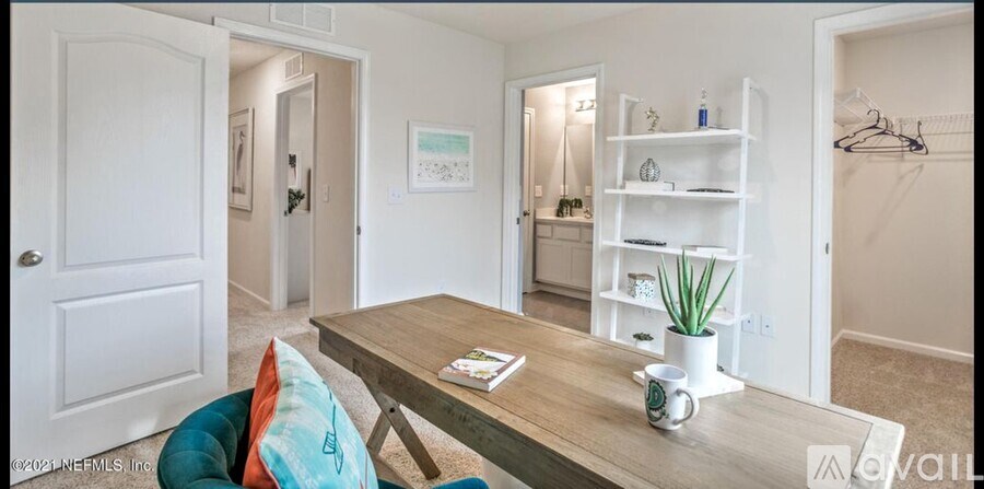 A dining room with a wooden table and a blue chair.