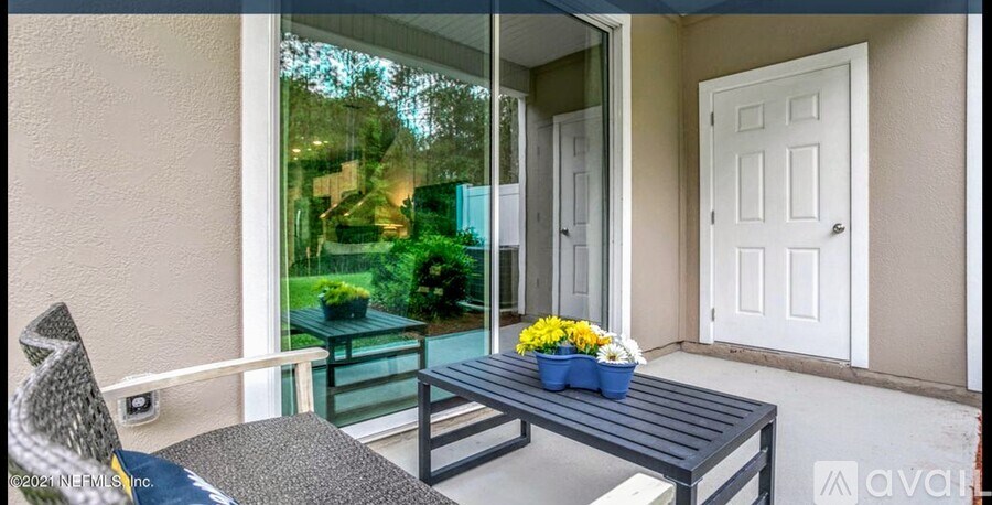 A patio with a table and chairs is shown.