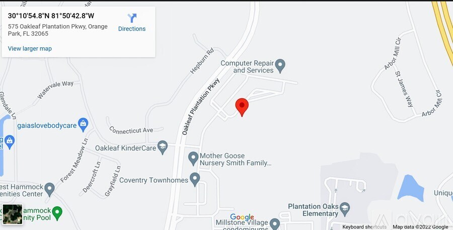 A map shows a red pin marking a location near a Computer Repair and Services business.