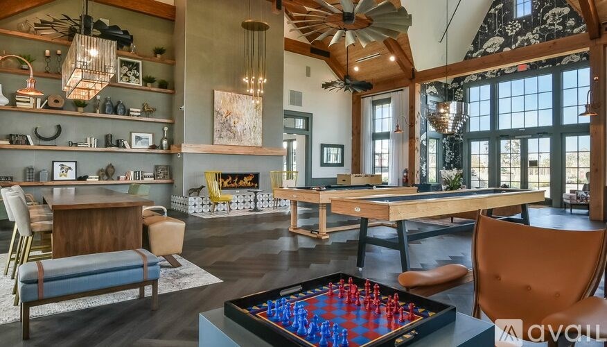 A room with a chessboard in the center of a table.