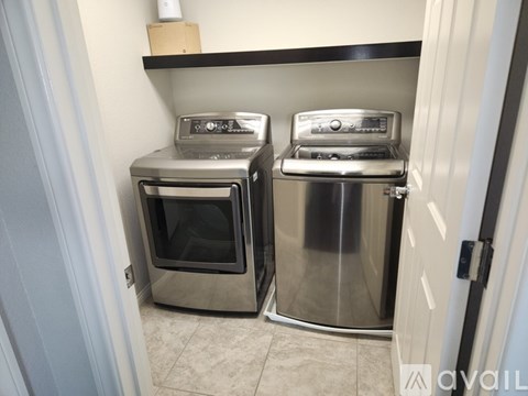 Two stainless steel ovens are in a kitchen.