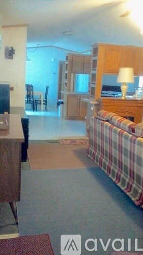 A living room with a couch and a television.