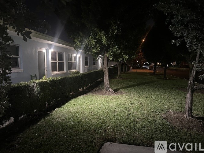 A house with lights on at night.