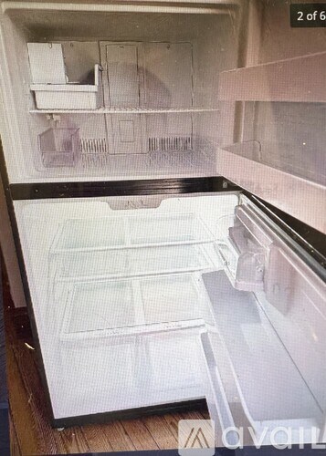 A white model of a kitchen with a refrigerator, sink, and cabinets.