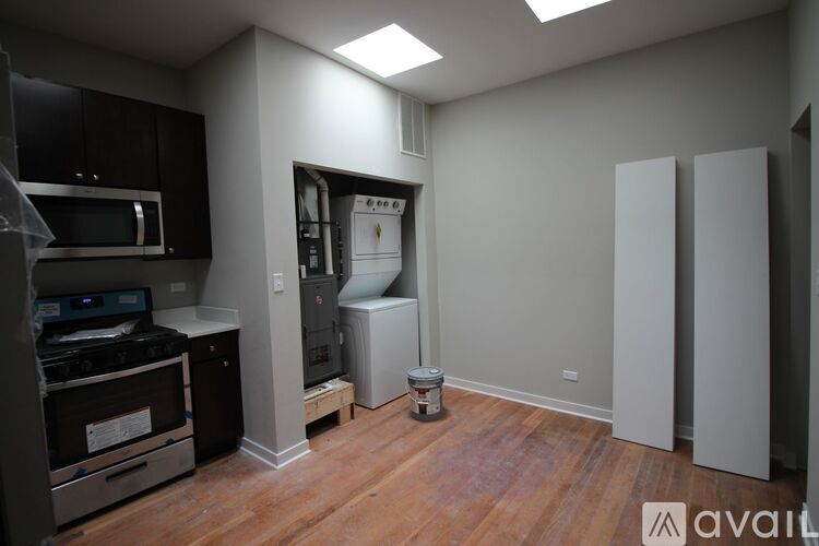 A kitchen area with a stove, oven, and refrigerator.