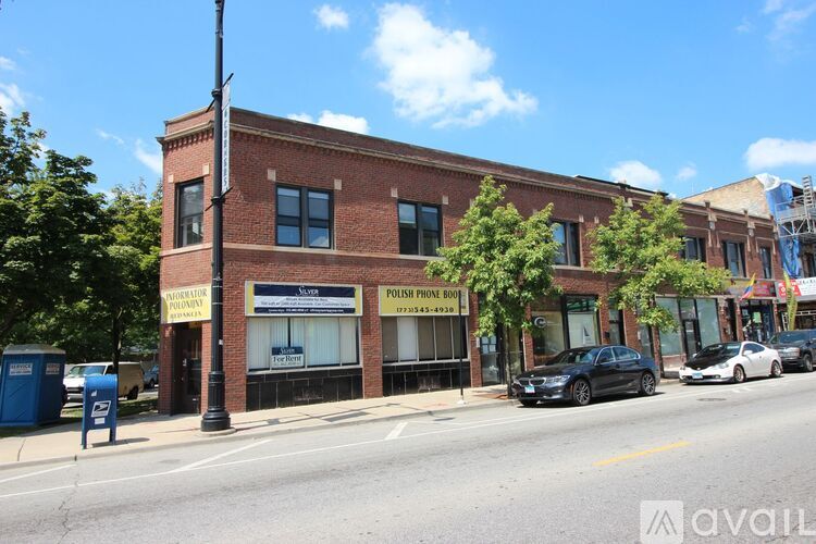 A street view of a building with a sign that reads "Point Phone Book".
