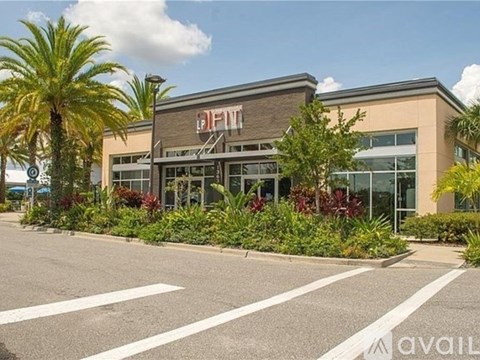 A palm tree is in front of a building with a sign that says "DIFF".