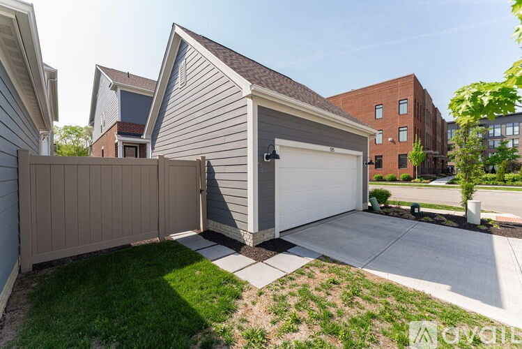 A house with a garage is for sale.