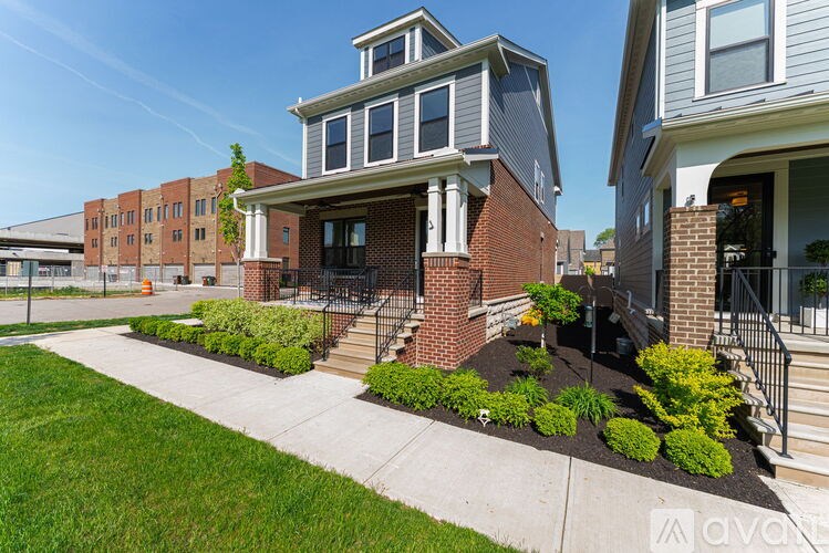 A house with a front yard and a small garden.