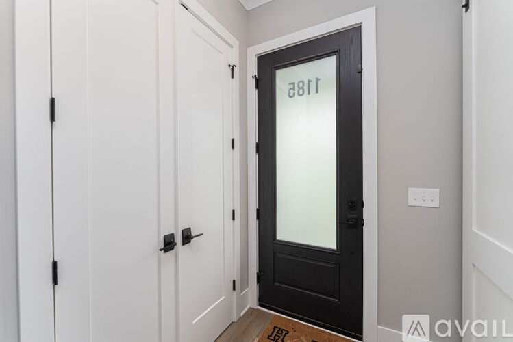 A black door with the number 881 on it.