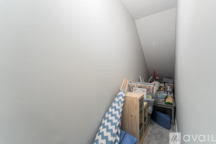 A small room with a bed and a desk.