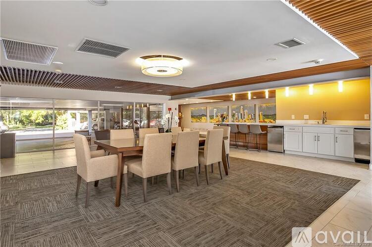 A dining room with a table set for six.