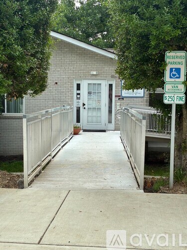 A sign indicates that the parking space is reserved for handicapped and van accessibility.