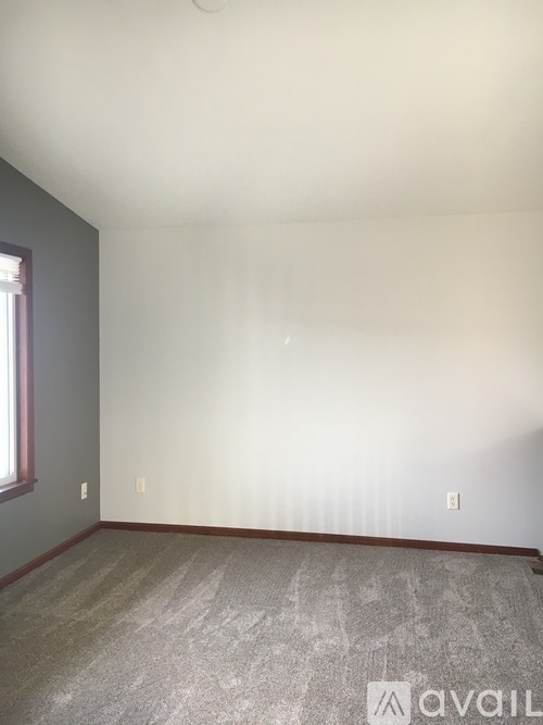 A room with Avail sign on the floor.