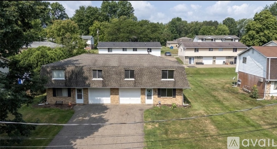 A house with a garage is available for sale.