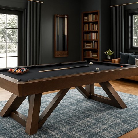 A pool table in a room with a bookshelf and a window.