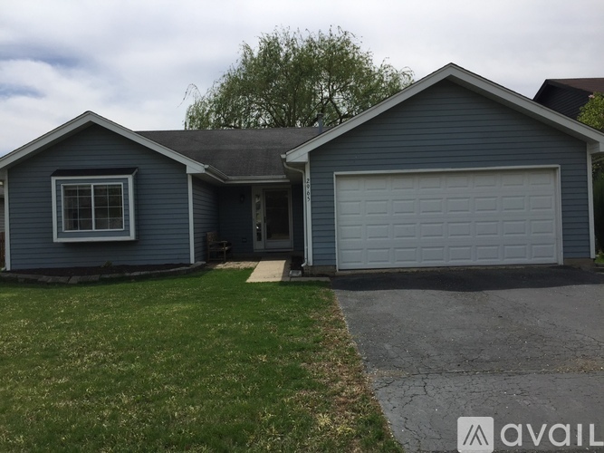 A two-car garage is attached to a house.