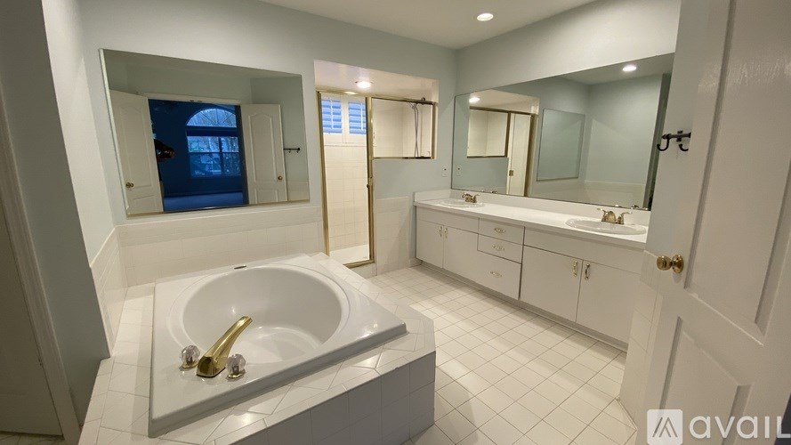A bathroom with a tub and a sink.