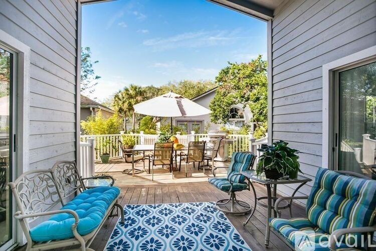 A patio with a table and chairs is shown.