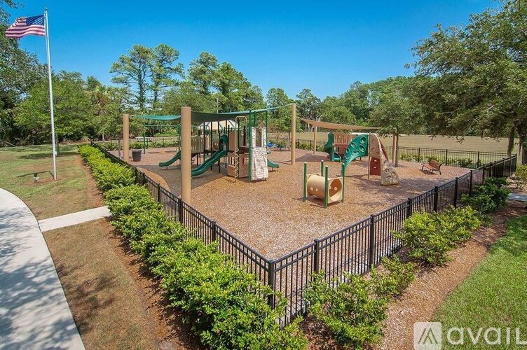 A playground with a swing set and a slide.