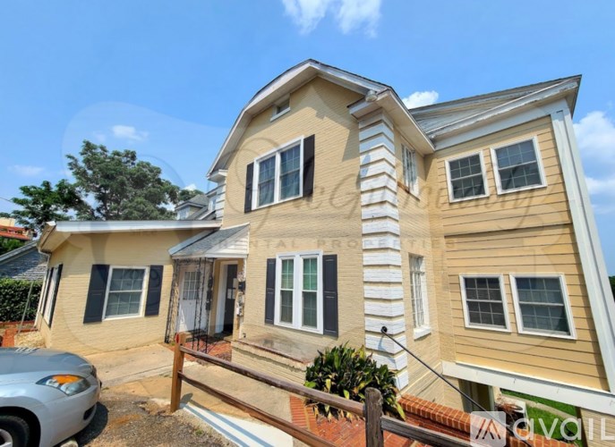 A house with a car parked in front of it.
