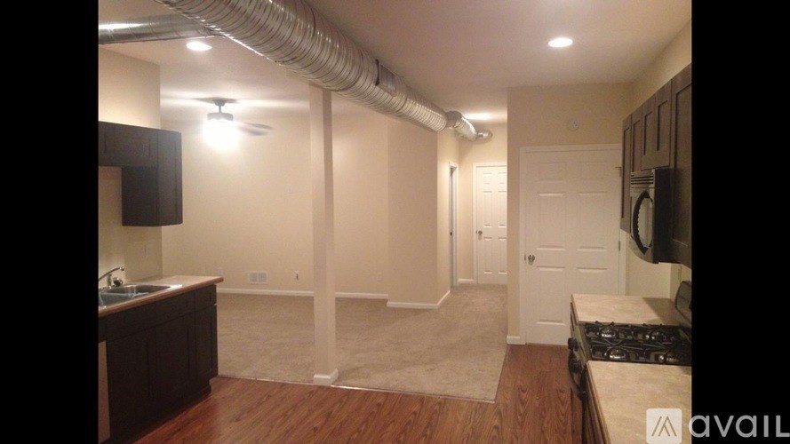 A kitchen area with a sink and a counter.