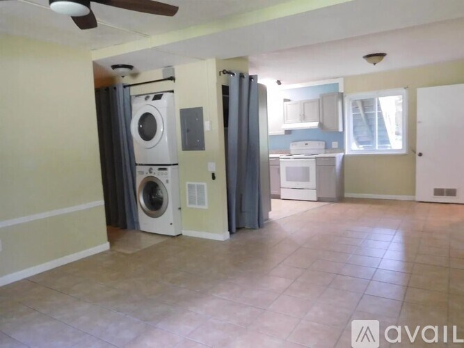 A room with a washer and dryer set up in it.