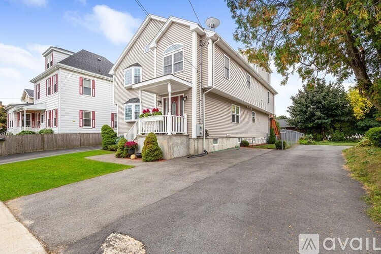 A large house with a driveway in front of it.