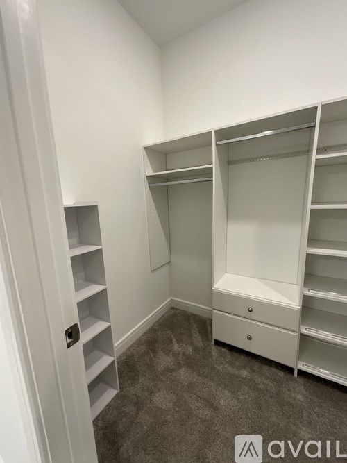 A white closet with shelves and drawers.