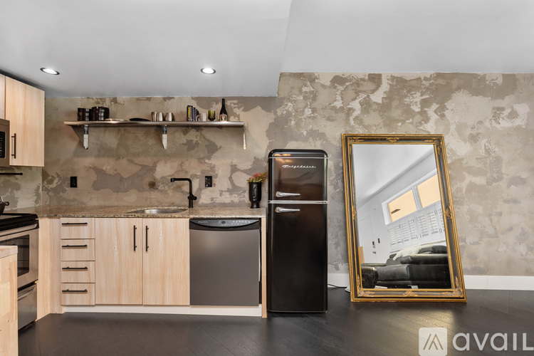 A black and white checkered floor in a kitchen.