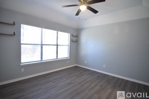 A kitchen with a refrigerator, microwave, oven, and dishwasher.