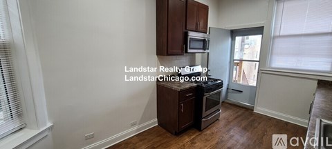 A kitchen with wooden cabinets and a stainless steel oven.