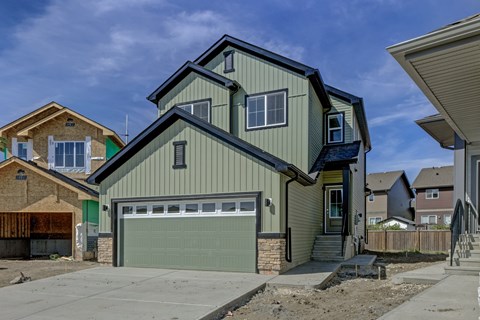 A two-story house with a garage is shown in the image.